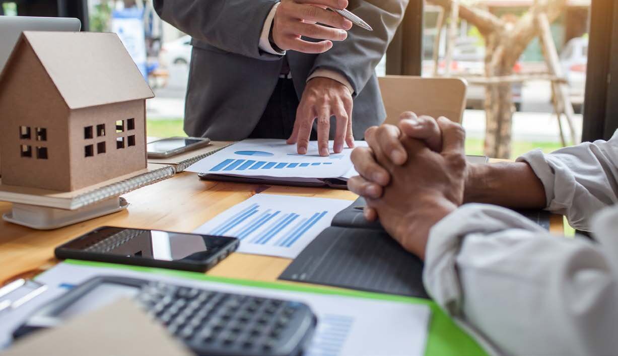 Business owner and advisor reviewing documents